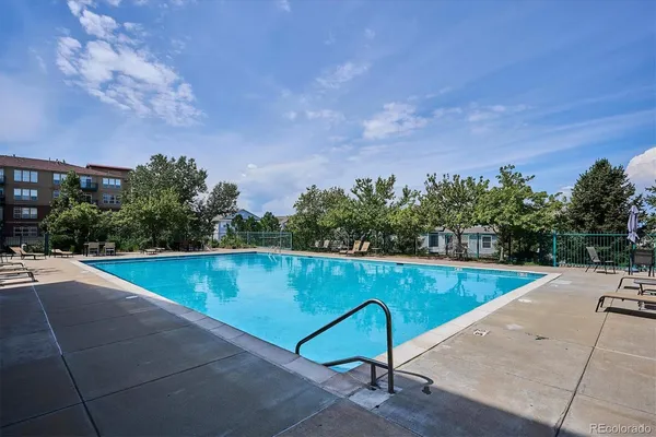 a view of a patio with a table and chairs