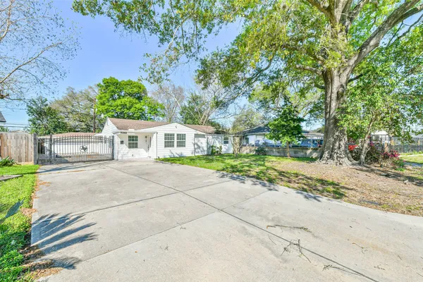 a front view of a house with a yard and a garage