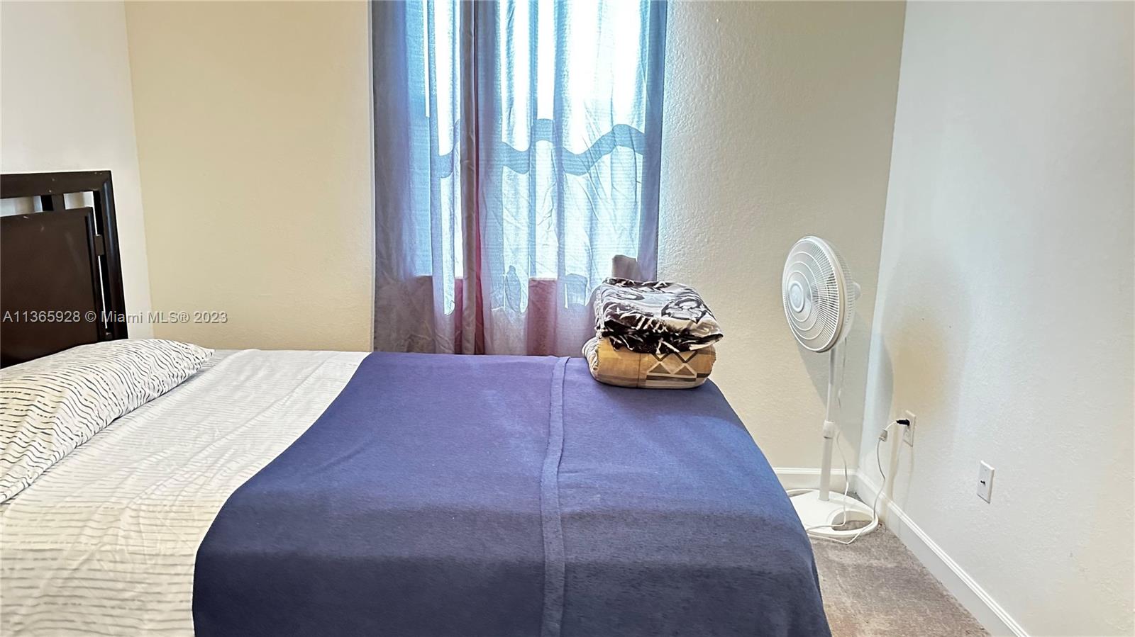 28661 Southwest 132nd Place Homestead, FL 33033 - Photo 14 of 22 a bedroom with bed and a window