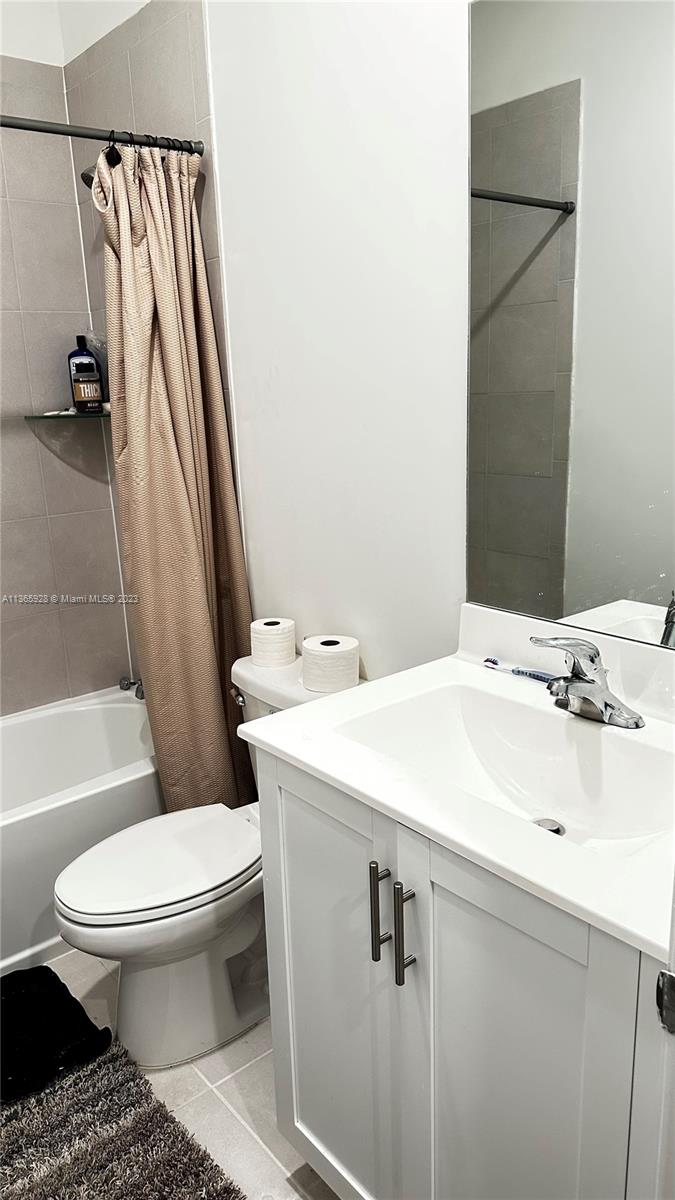 28661 Southwest 132nd Place Homestead, FL 33033 - Photo 16 of 22 a bathroom with a sink toilet and shower