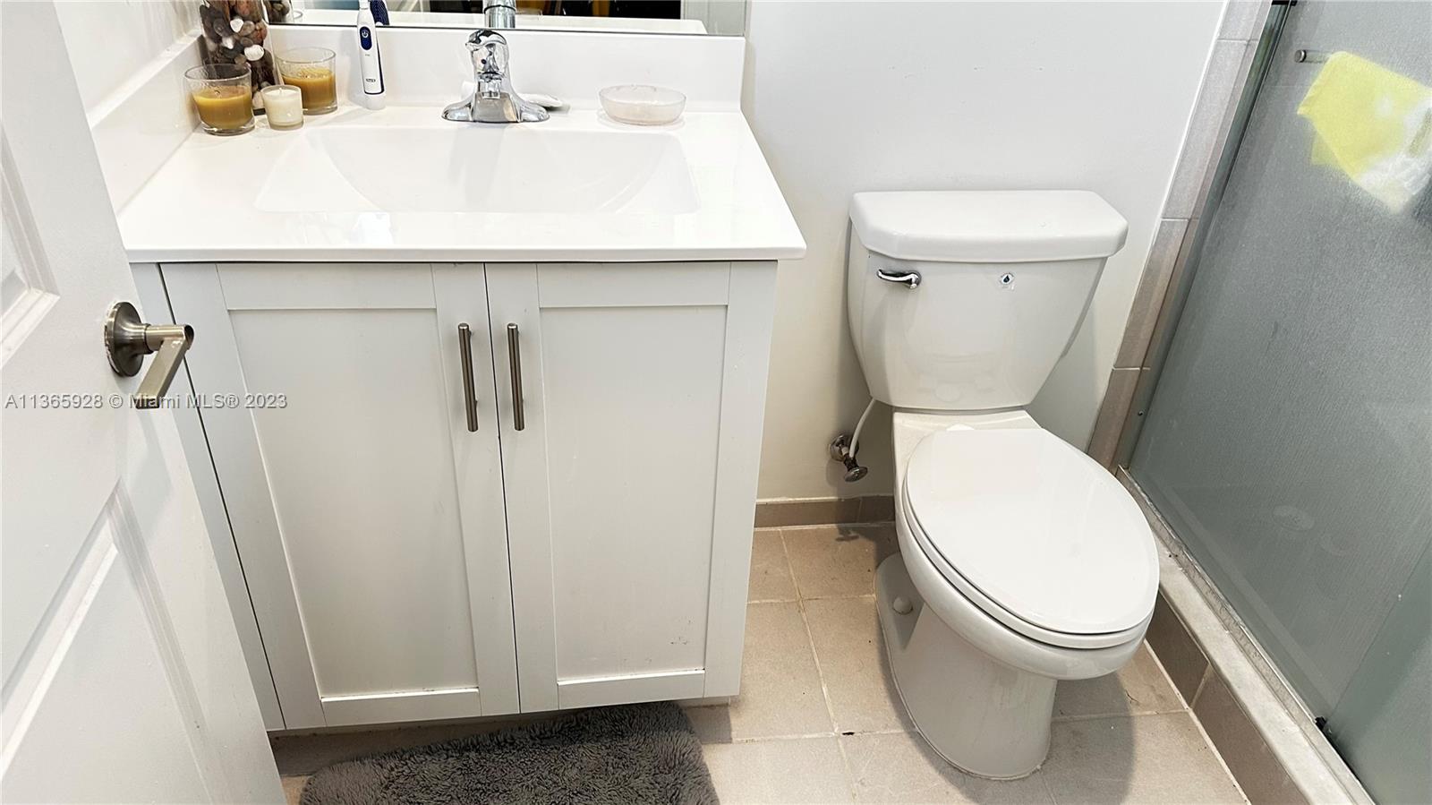 28661 Southwest 132nd Place Homestead, FL 33033 - Photo 19 of 22 a white toilet sitting next to a bathroom sink