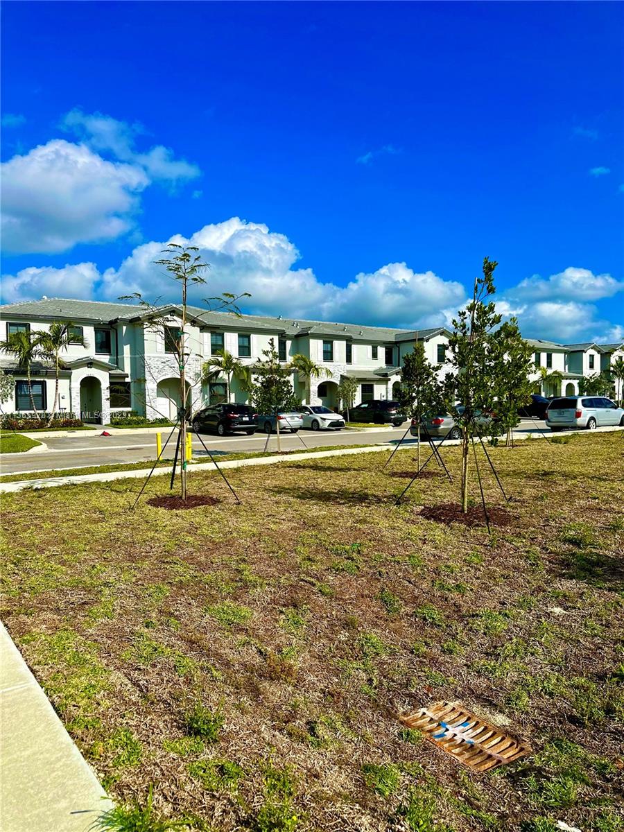 28661 Southwest 132nd Place Homestead, FL 33033 - Photo 21 of 22 a view of a building with a yard