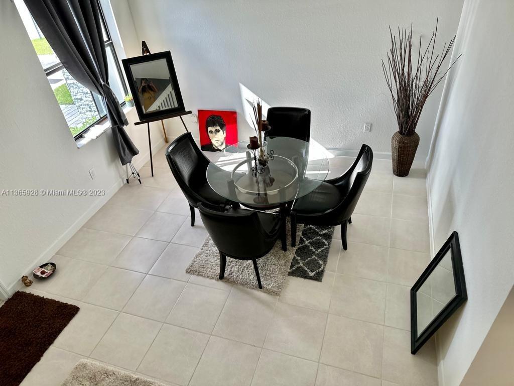 28661 Southwest 132nd Place Homestead, FL 33033 - Photo 3 of 22 a view of a workspace with furniture