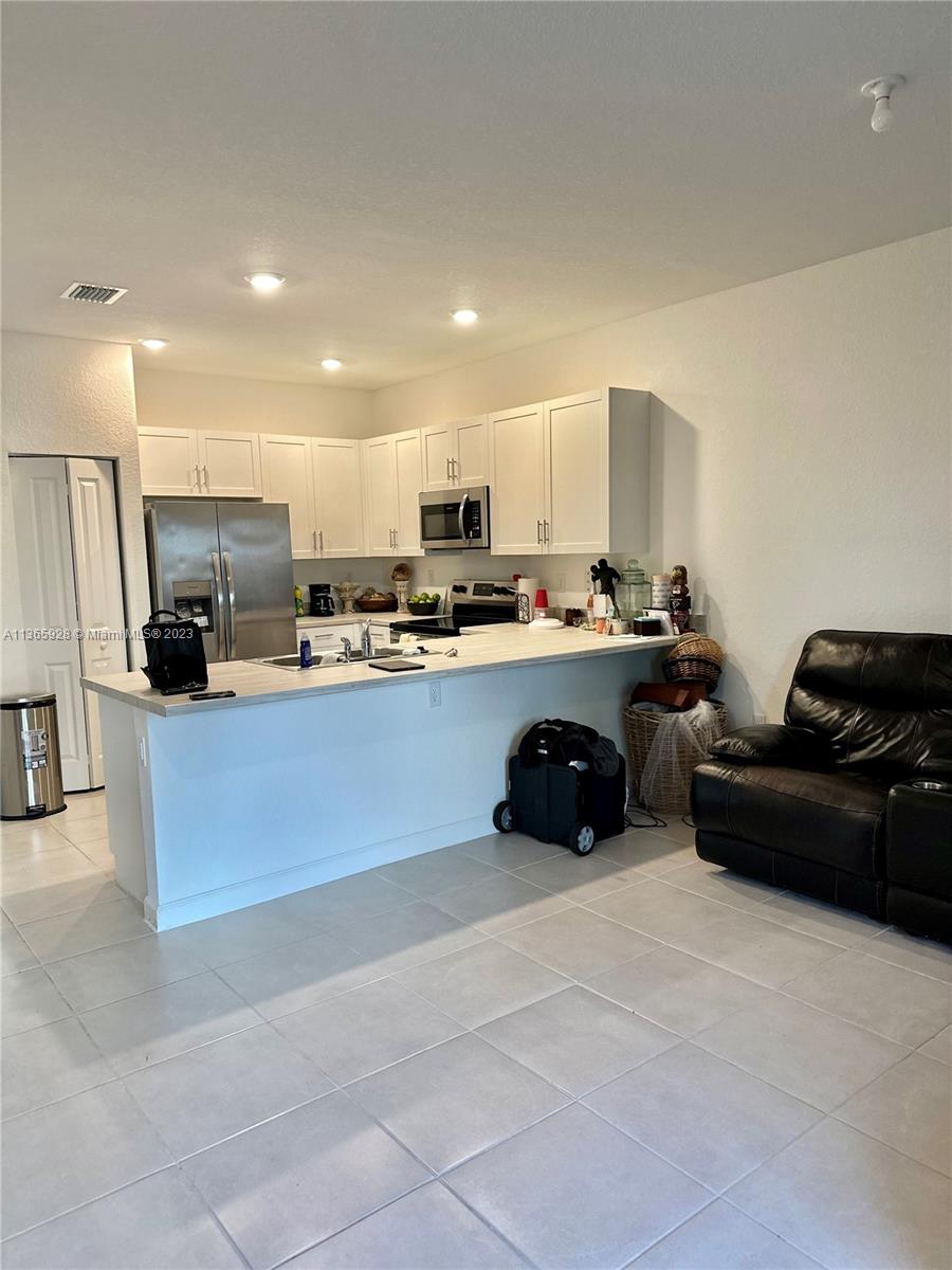 28661 Southwest 132nd Place Homestead, FL 33033 - Photo 4 of 22 a kitchen with stainless steel appliances lots of counter top space