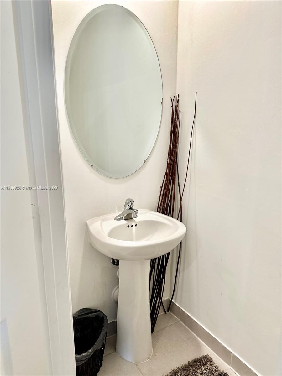 28661 Southwest 132nd Place Homestead, FL 33033 - Photo 9 of 22 a bathroom with a sink and a mirror