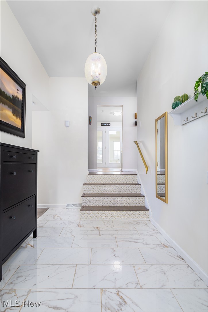 137 Preston Road Steubenville, OH 43953 - Photo 4 of 38 Stairs featuring baseboards and marble finish floor