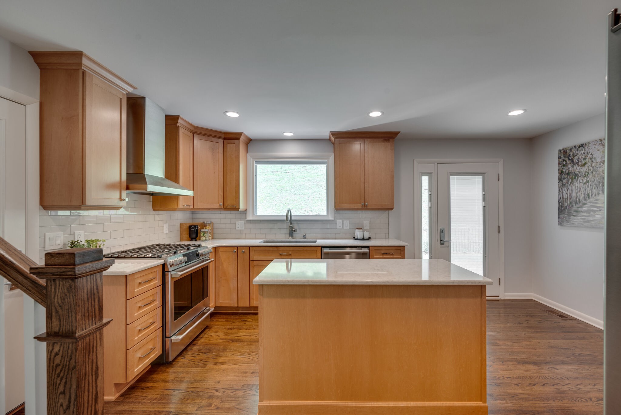 6612 Ellesmere Road Nashville, TN 37205 - Photo 11 of 34 a kitchen with stainless steel appliances granite countertop wooden cabinets a stove top oven a sink and dishwasher