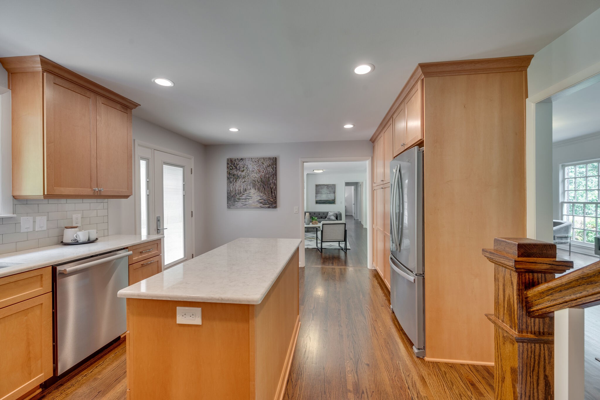 6612 Ellesmere Road Nashville, TN 37205 - Photo 13 of 34 a kitchen with stainless steel appliances granite countertop a refrigerator a sink dishwasher and a stove with wooden floor