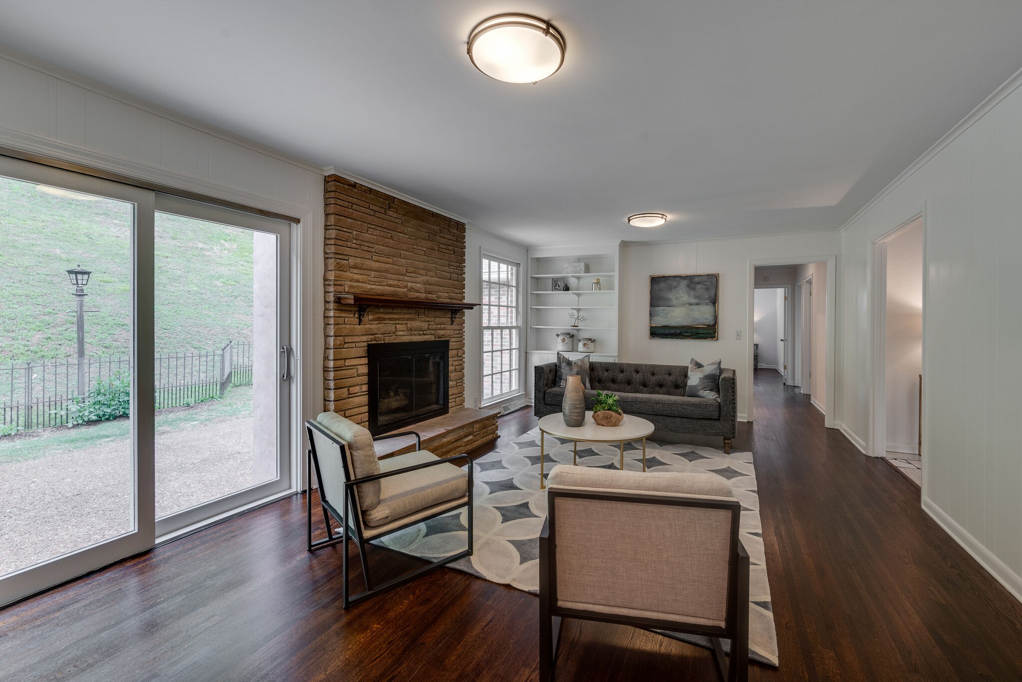 6612 Ellesmere Road Nashville, TN 37205 - Photo 16 of 34 a living room with furniture wooden floor and a fireplace