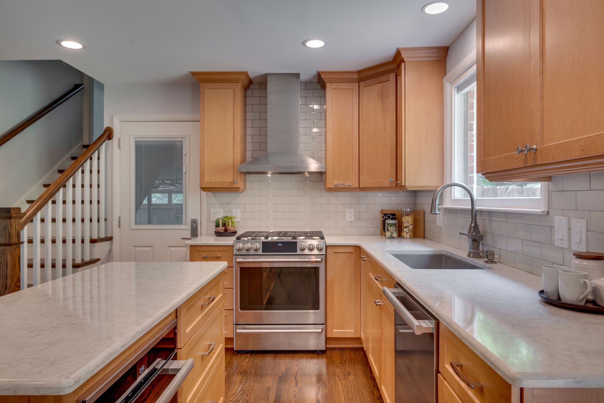 6612 Ellesmere Road Nashville, TN 37205 - Photo 10 of 34 a kitchen with a sink stove and cabinets