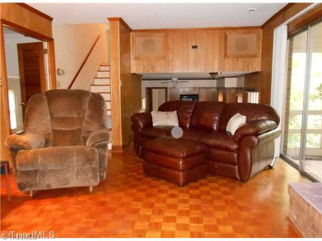 2020 Huntington Road Burlington, NC 27215 - Photo 9 of 15 Den/Family/Great Room. den with parquet flooring and sliding doors to screened porch