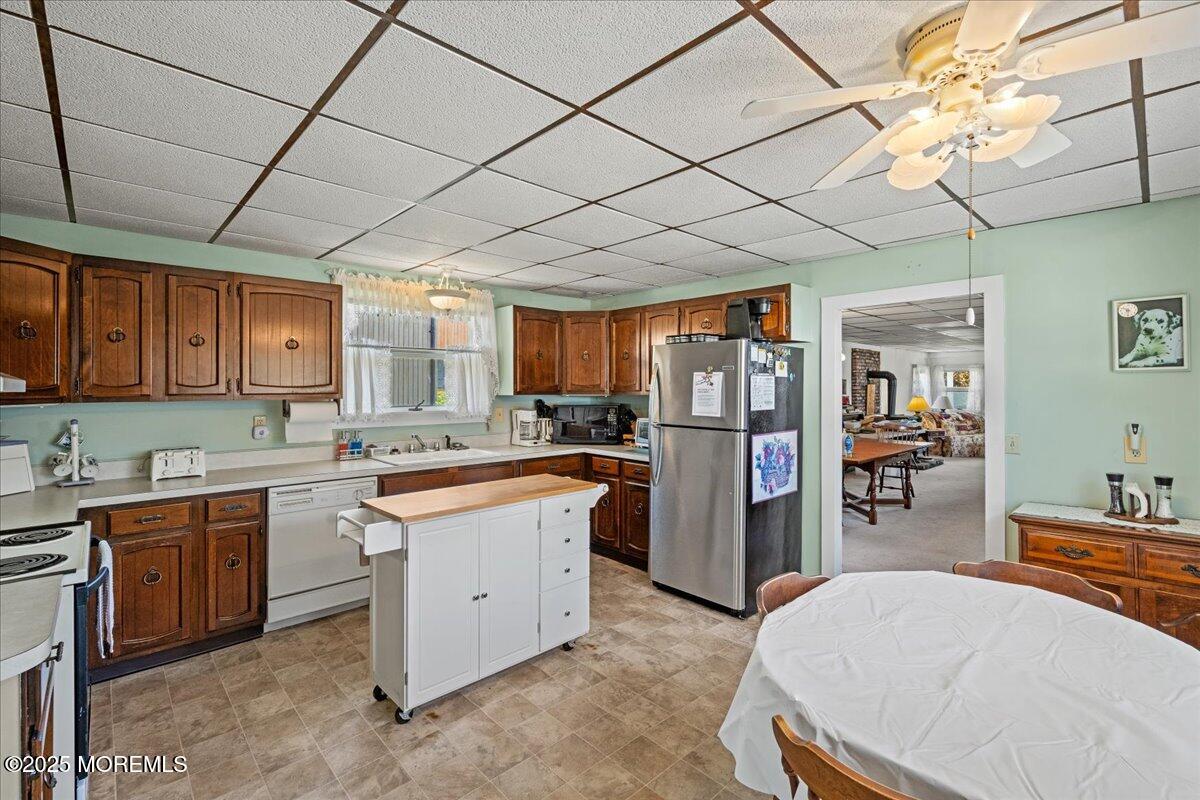 418 Salem Avenue Spring Lake, NJ 07762 - Photo 11 of 29 a kitchen with stainless steel appliances granite countertop a sink and cabinets