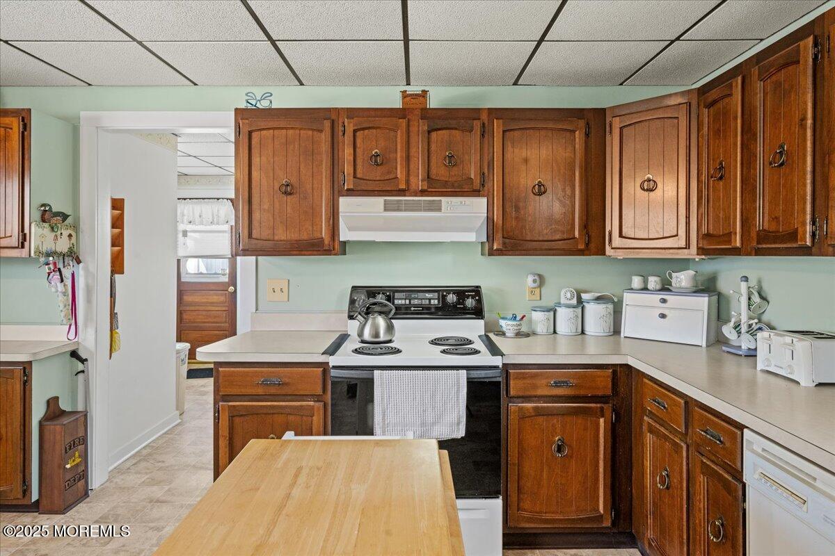 418 Salem Avenue Spring Lake, NJ 07762 - Photo 13 of 29 a kitchen with stainless steel appliances granite countertop a stove a sink dishwasher and cabinets