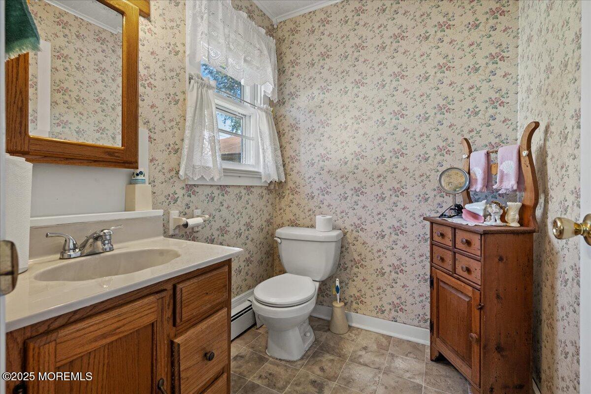 418 Salem Avenue Spring Lake, NJ 07762 - Photo 19 of 29 a bathroom with a toilet sink and mirror