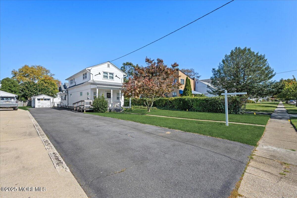 418 Salem Avenue Spring Lake, NJ 07762 - Photo 5 of 29 a view of a white house with a big yard and potted plants