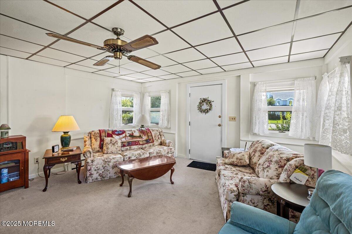 418 Salem Avenue Spring Lake, NJ 07762 - Photo 8 of 29 a living room with furniture and a chandelier