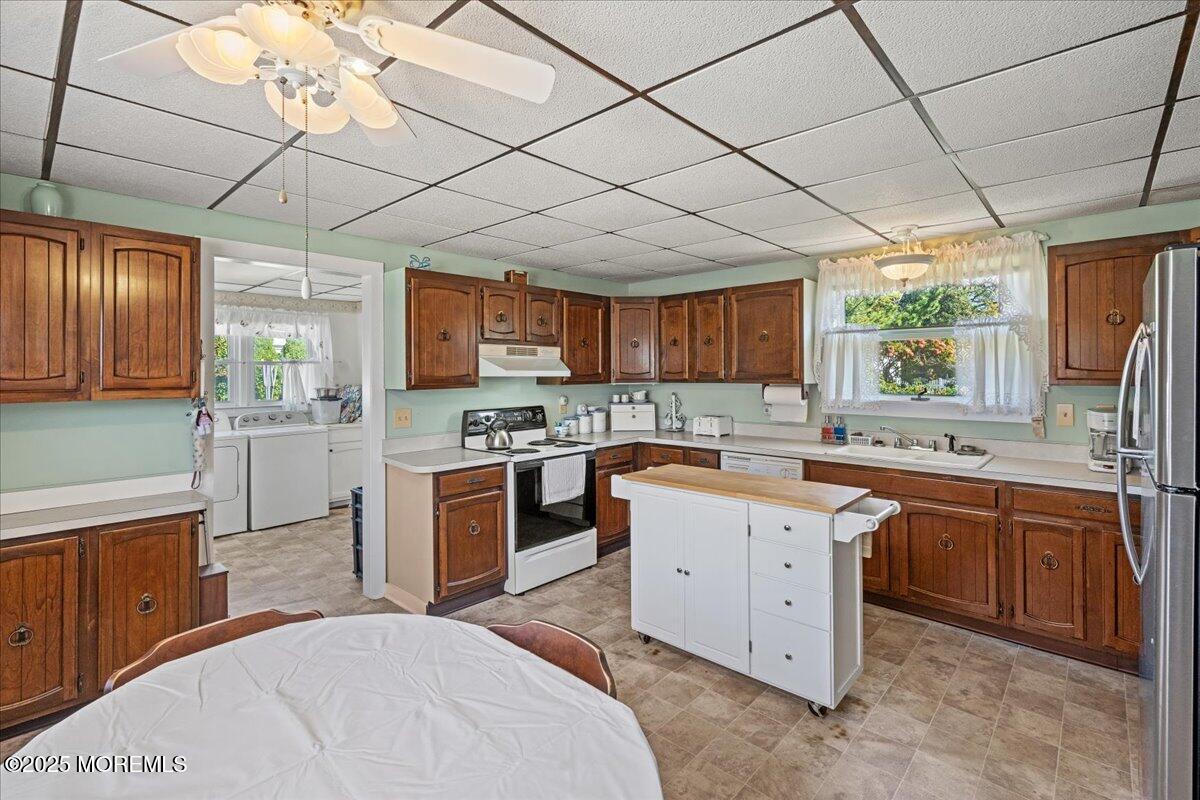 418 Salem Avenue Spring Lake, NJ 07762 - Photo 10 of 29 a kitchen with a sink window and cabinets