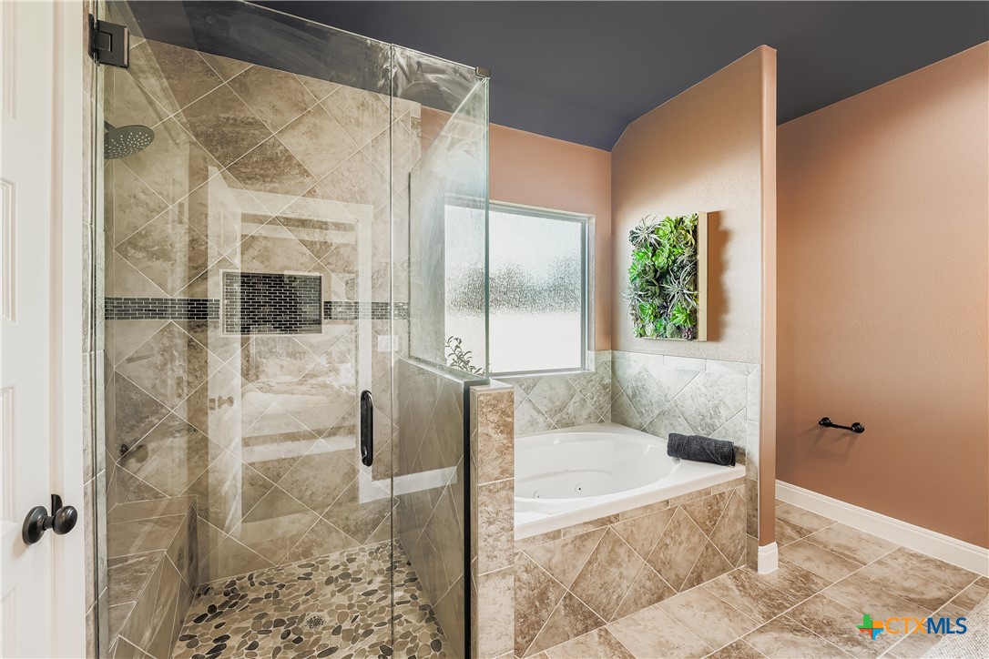 222 Arosa Drive Elgin, TX 78621 - Photo 12 of 40 a bathroom with a tub and shower