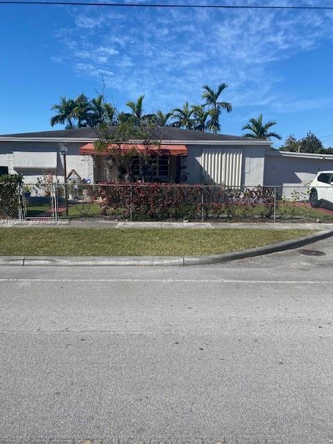 691 East 62nd Street Hialeah, FL 33013 - Photo 3 of 27 a view of a house with a yard and potted plants