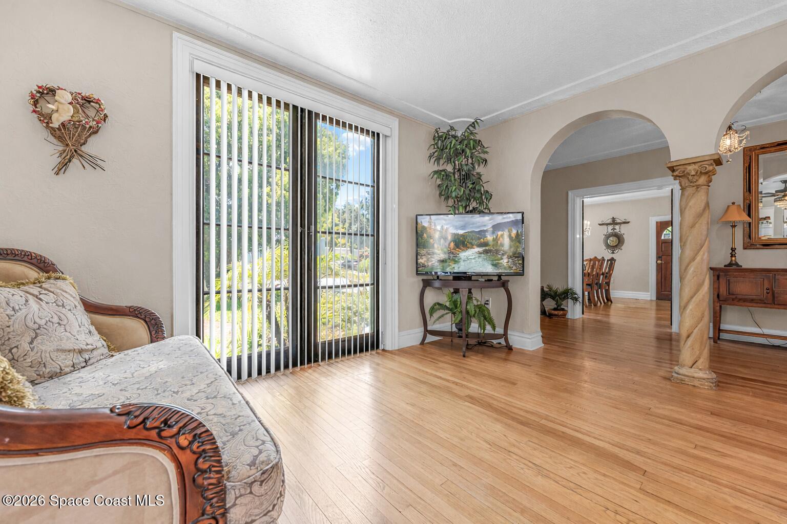 130 Valencia Road Rockledge, FL 32955 - Photo 16 of 68 Sunlit Living Room with Arched Entry