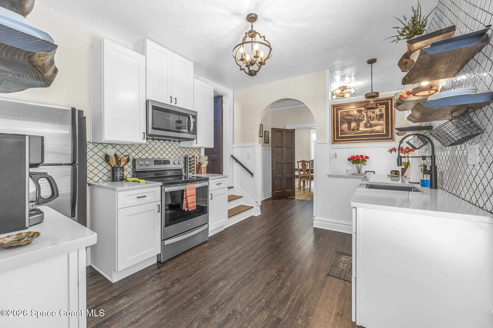 130 Valencia Road Rockledge, FL 32955 - Photo 23 of 68 Kitchen w/ Stair & Dining Access