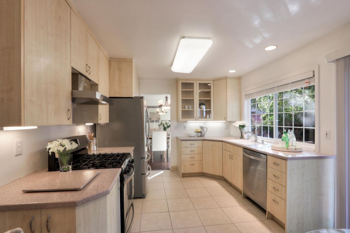 2250 Yosemite Drive Milpitas, CA 95035 - Photo 13 of 43 a kitchen with a sink stove and cabinets