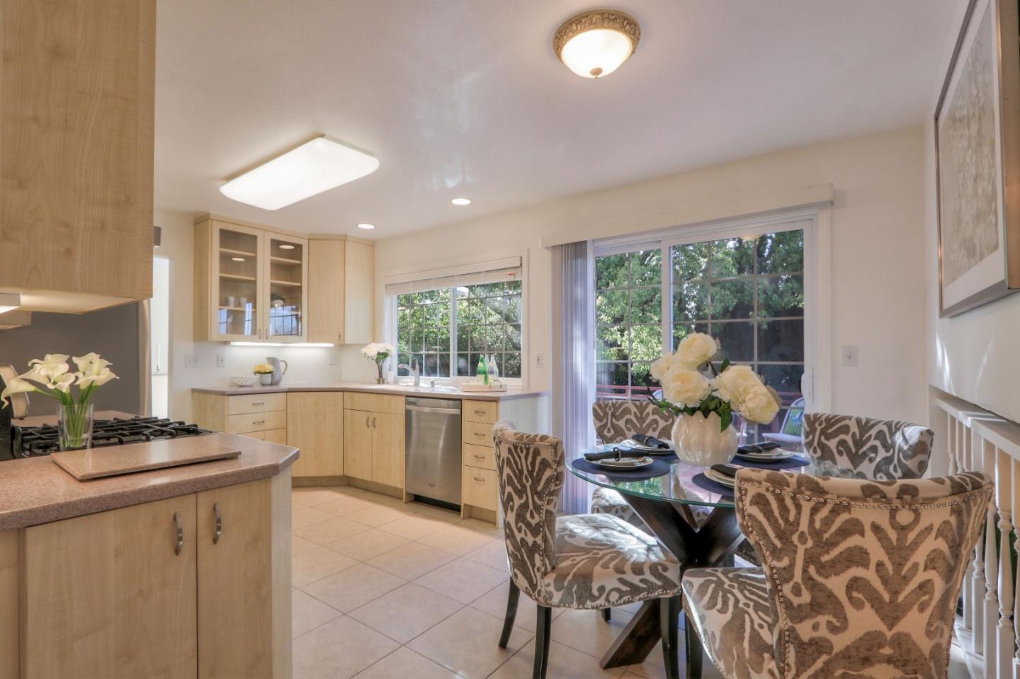 2250 Yosemite Drive Milpitas, CA 95035 - Photo 16 of 43 a dining room with furniture and large windows