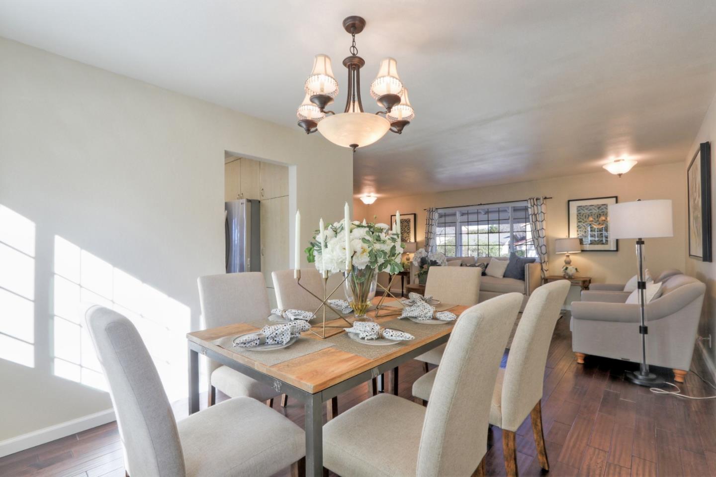 2250 Yosemite Drive Milpitas, CA 95035 - Photo 19 of 43 a view of a dining room with furniture and wooden floor