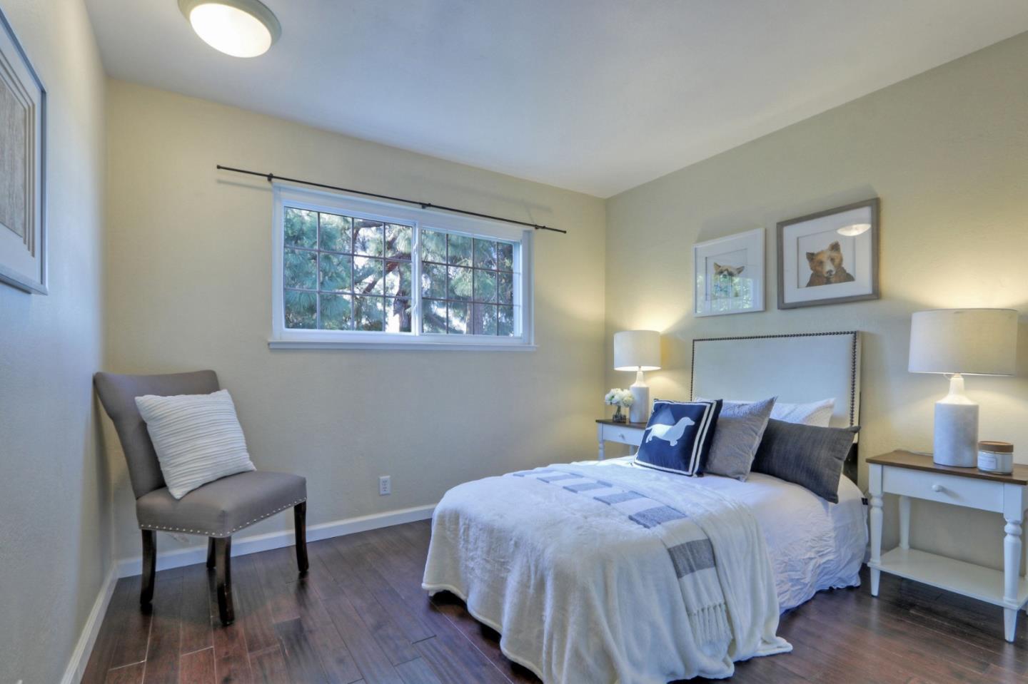 2250 Yosemite Drive Milpitas, CA 95035 - Photo 24 of 43 a bedroom with a bed and a lamp