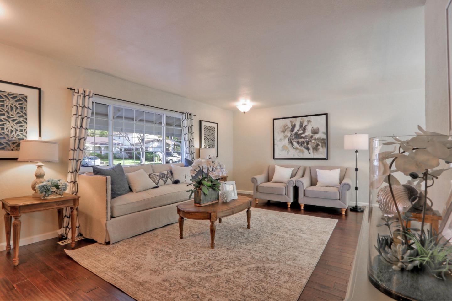 2250 Yosemite Drive Milpitas, CA 95035 - Photo 3 of 43 a living room with furniture or couch and a wooden floor
