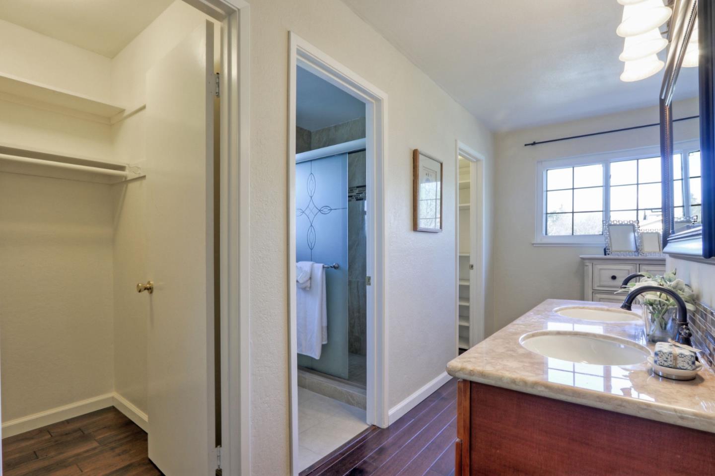 2250 Yosemite Drive Milpitas, CA 95035 - Photo 32 of 43 a bathroom with a granite countertop sink a mirror and shower