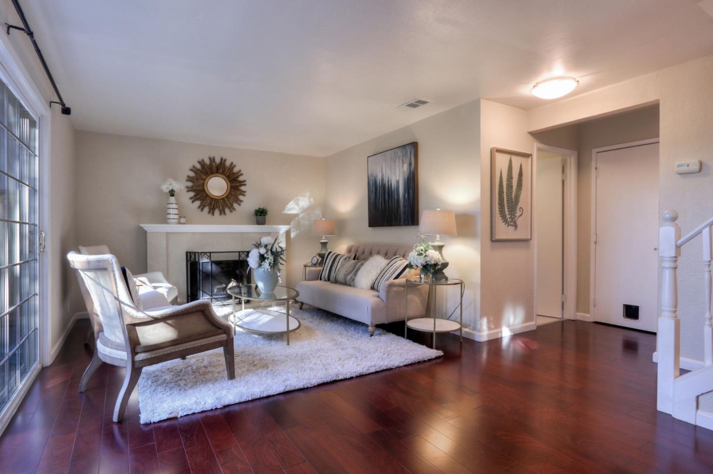 2250 Yosemite Drive Milpitas, CA 95035 - Photo 9 of 43 a living room with furniture and a fireplace
