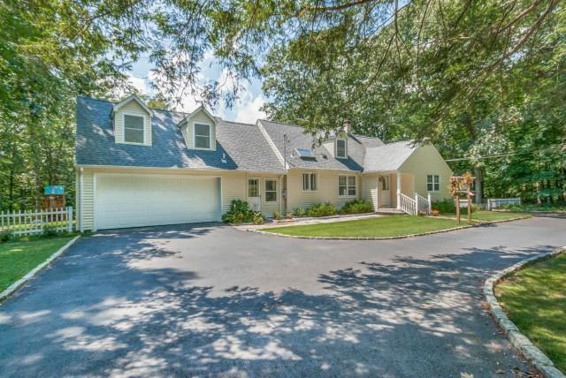 215 East Rocks Road Norwalk, CT 06851 - Photo 1 of 1 a front view of a house with a yard and garage