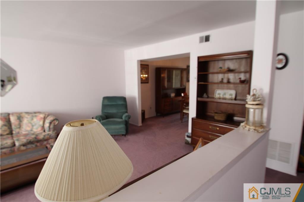 6605 Hana Road Edison, NJ 08817 - Photo 1 of 17 a room with gym equipment