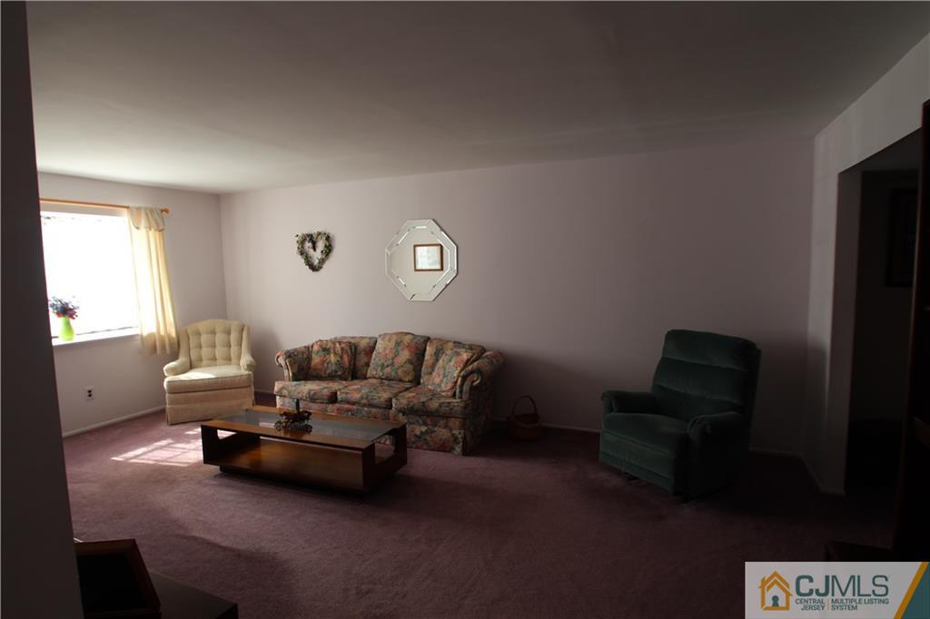 6605 Hana Road Edison, NJ 08817 - Photo 3 of 17 a living room with furniture and a window