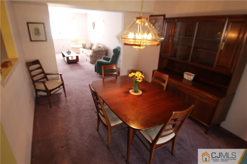 6605 Hana Road Edison, NJ 08817 - Photo 6 of 17 a view of a dining room with furniture and wooden floor