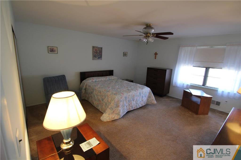 6605 Hana Road Edison, NJ 08817 - Photo 8 of 17 a bedroom with bed and window