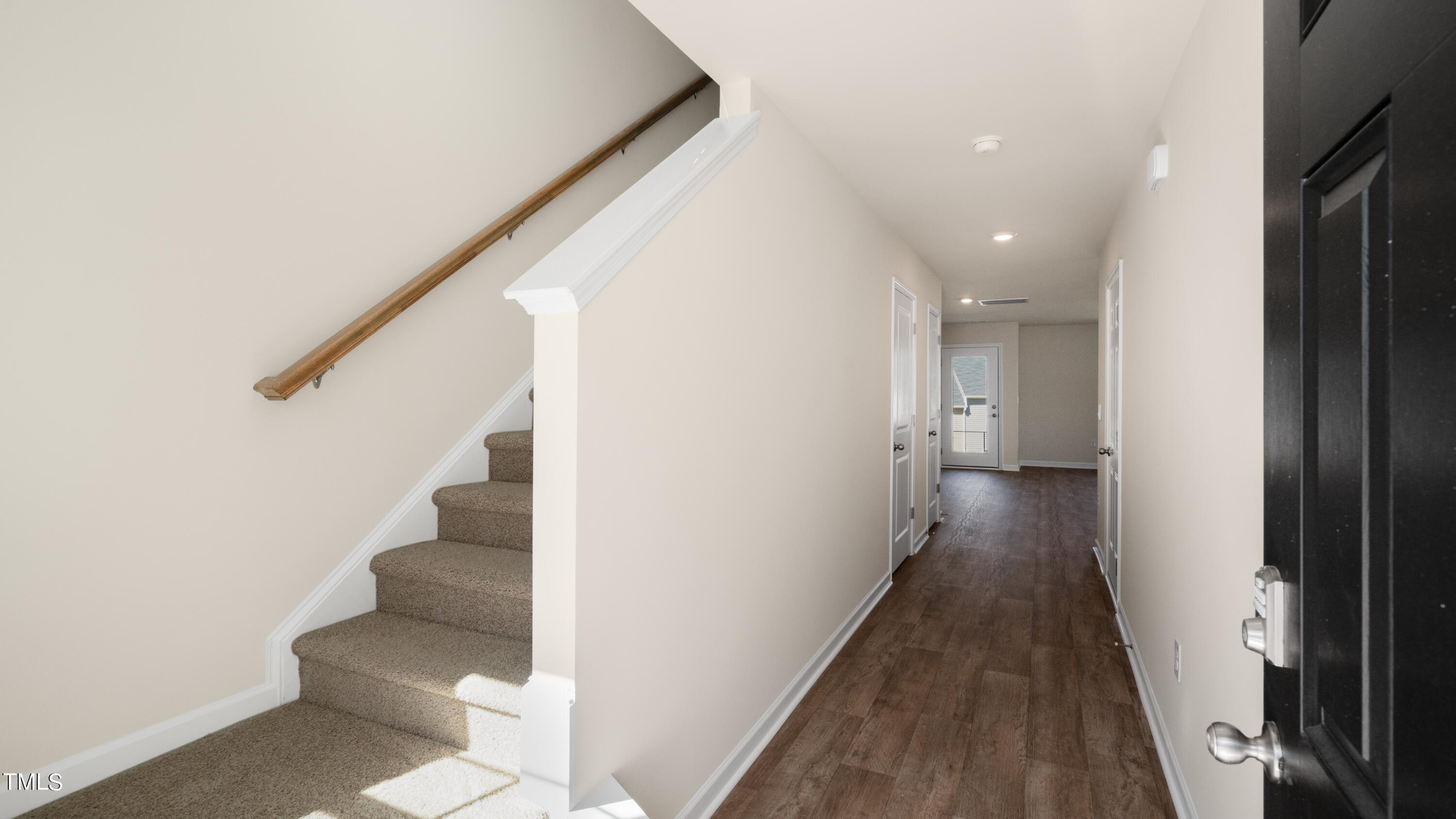 3202 Alibird Lane Carthage, NC 28327 - Photo 11 of 33 a view of a hallway with stairs