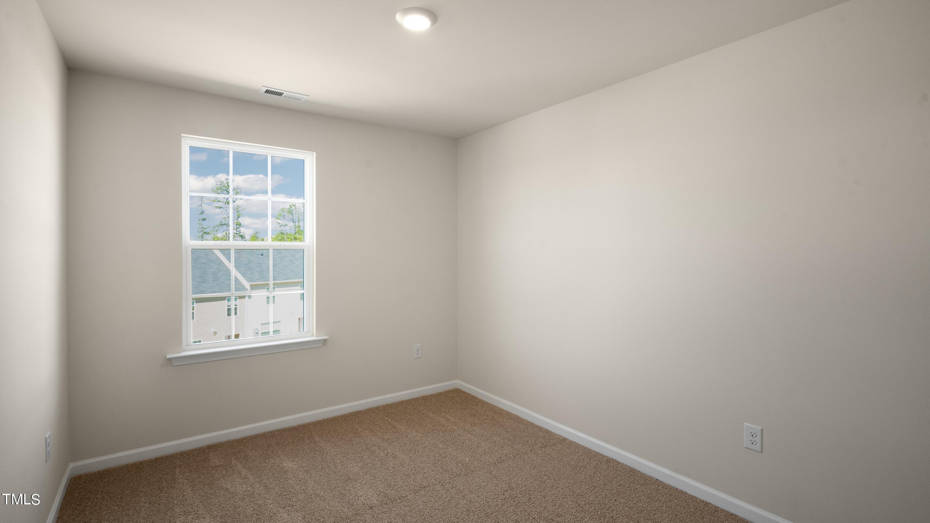 3202 Alibird Lane Carthage, NC 28327 - Photo 22 of 33 an empty room with a window