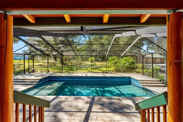 a view of outdoor space with deck and wooden floor