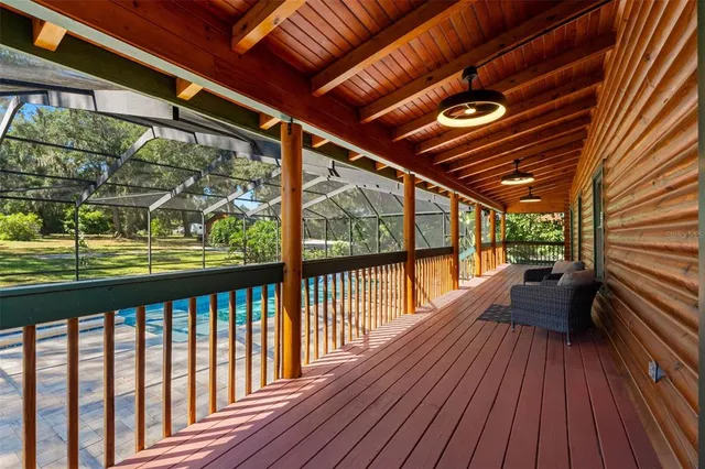 a view of a chairs and table in the balcony