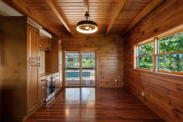 a view of porch with wooden floor