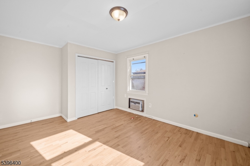 136 Clifton Boulevard Clifton, NJ 07011 - Photo 14 of 16 an empty room with a natural light