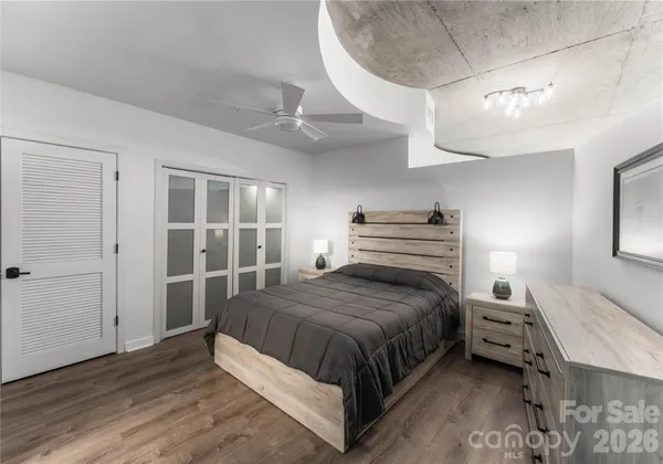 a bedroom with a bed and a dresser