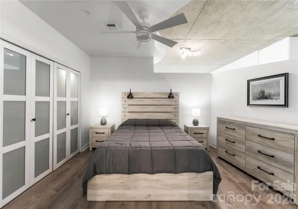 a bed room with a bed and a dresser