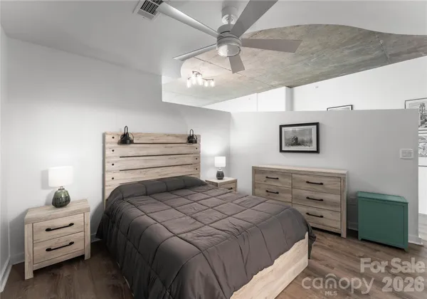 a bedroom with a bed and a dresser