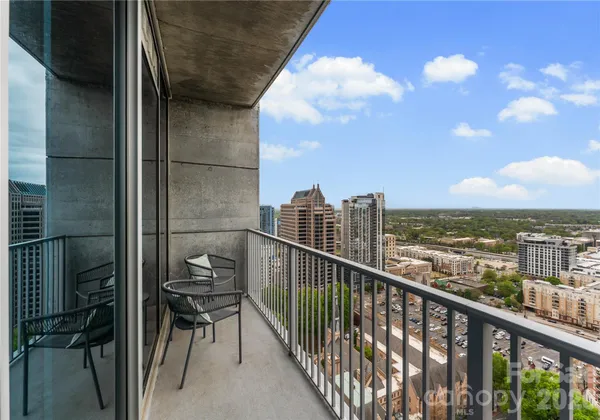 a view of a balcony with city view
