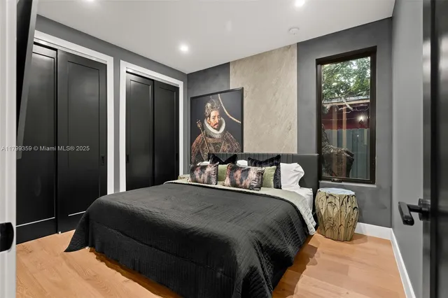 a bed room with a bed and a television