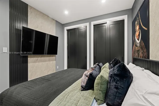 a bathroom with a sink vanity mirror and toilet