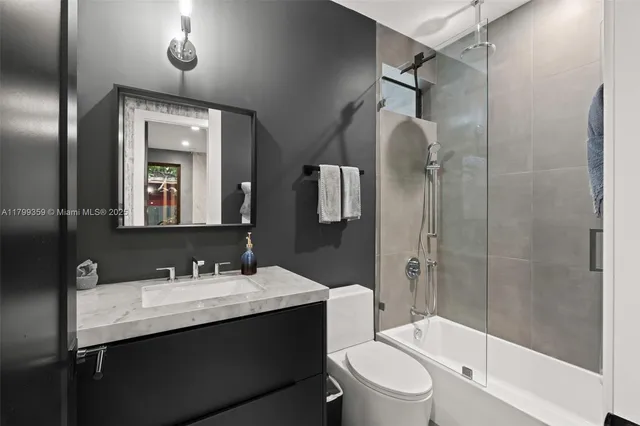 a bathroom with a shower and toilet
